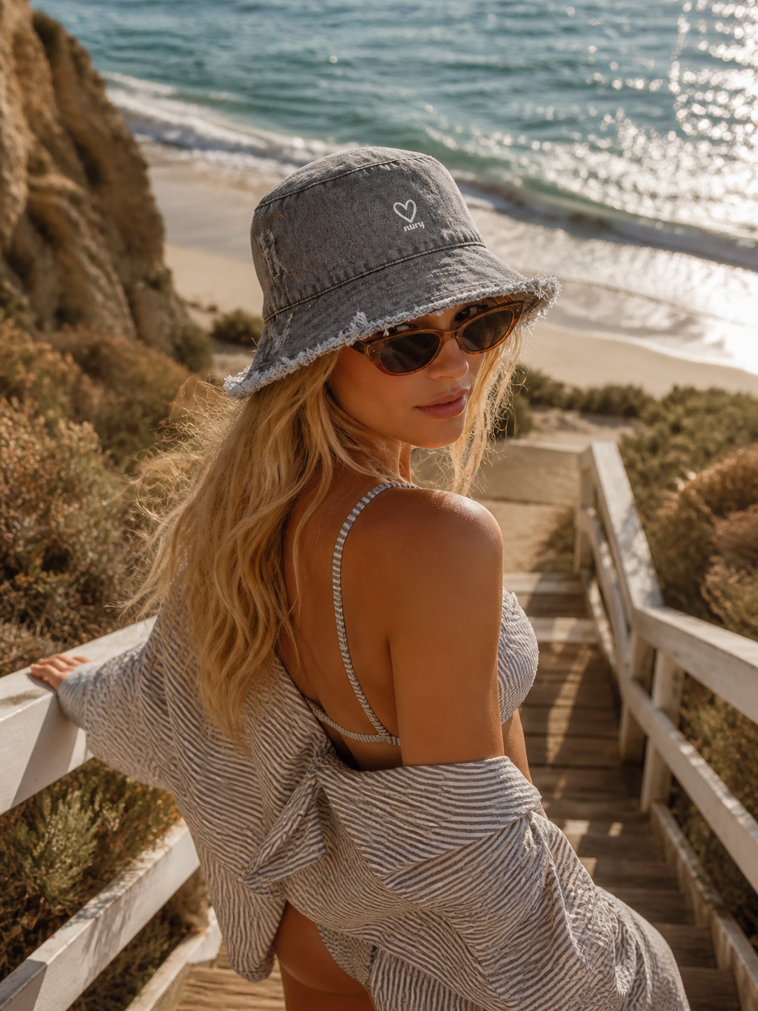 Gray denim frayed edge bucket hat close-up detail