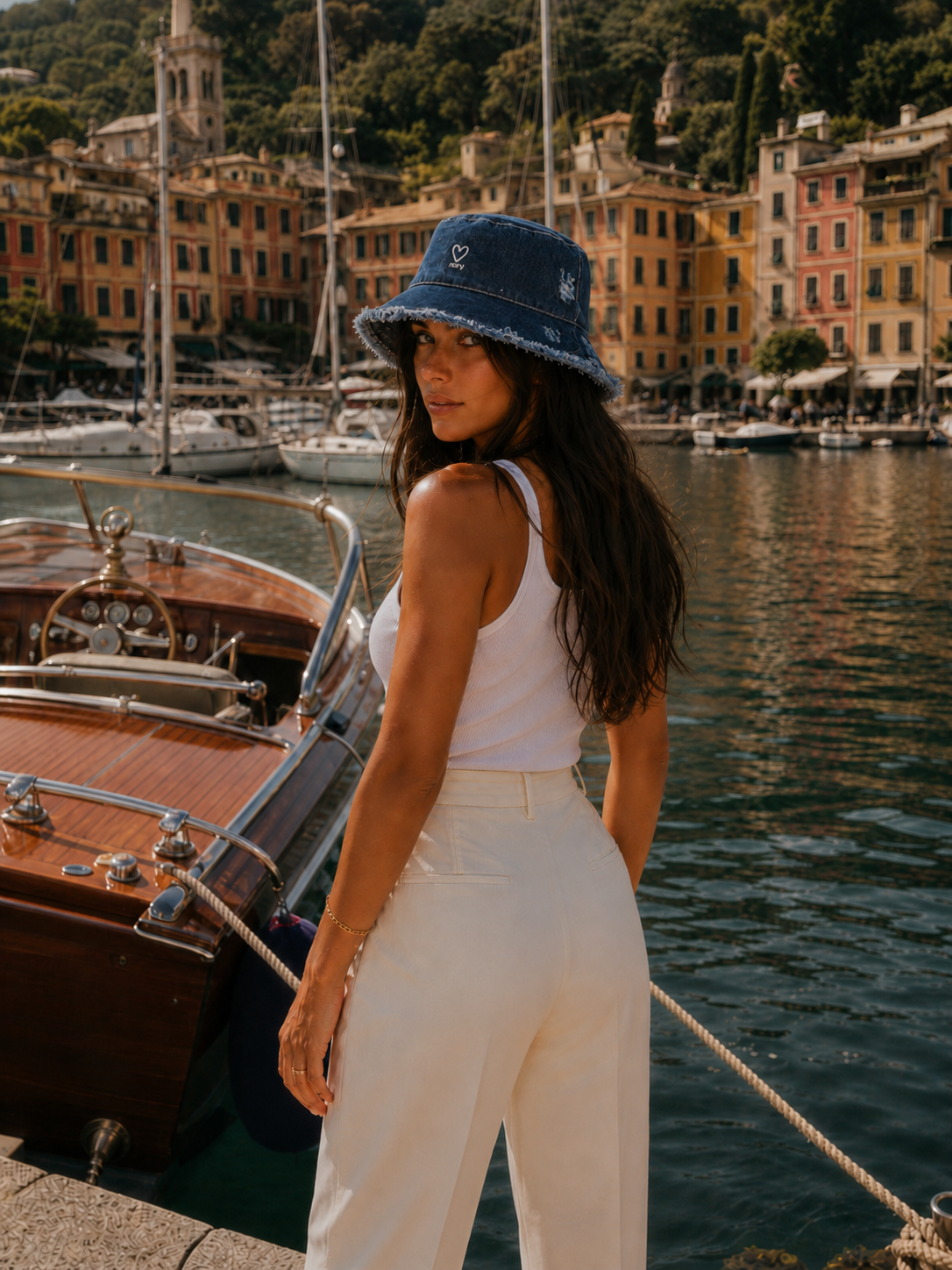 Model wearing blue denim frayed edge bucket hat